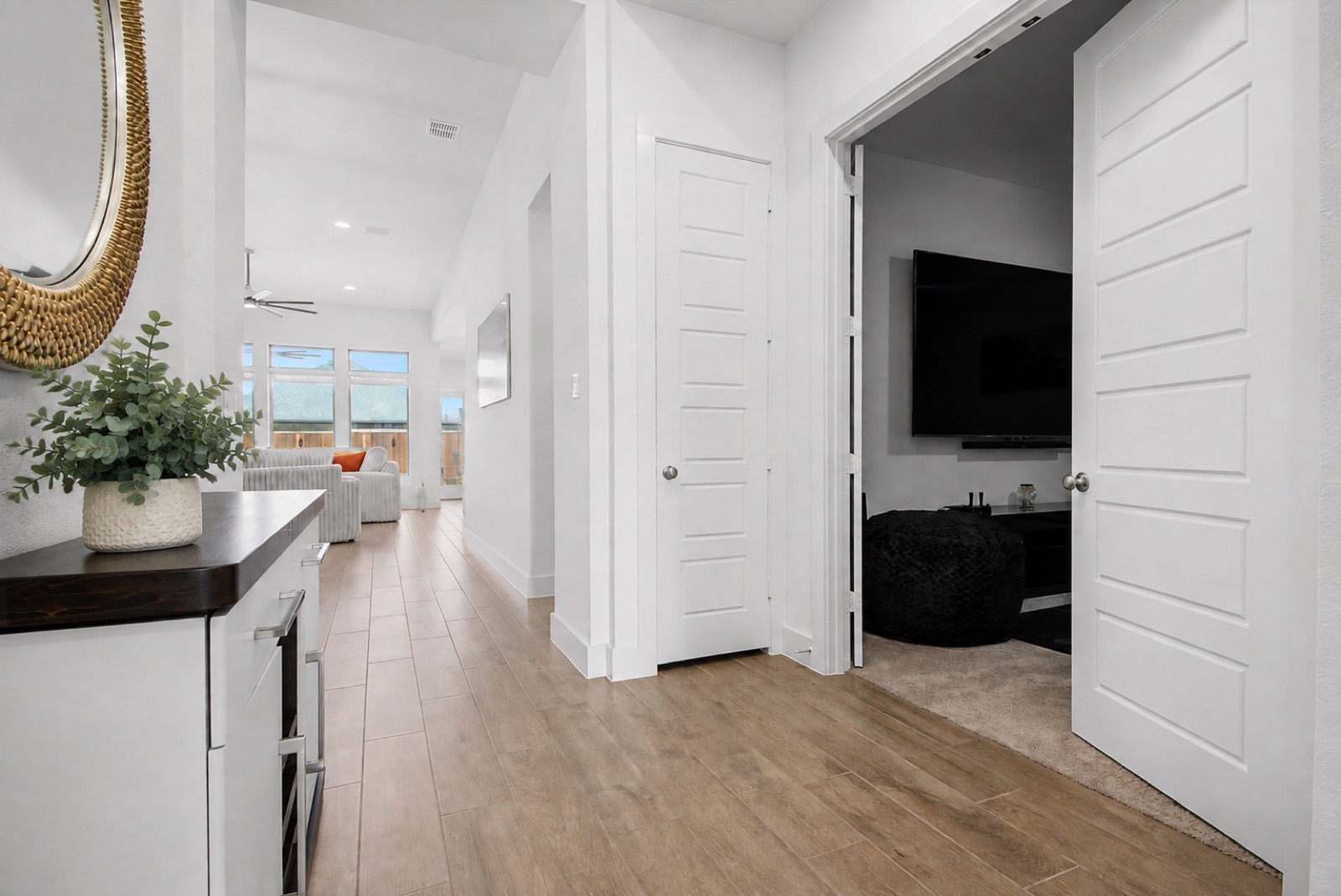 Hallway and media room French doors