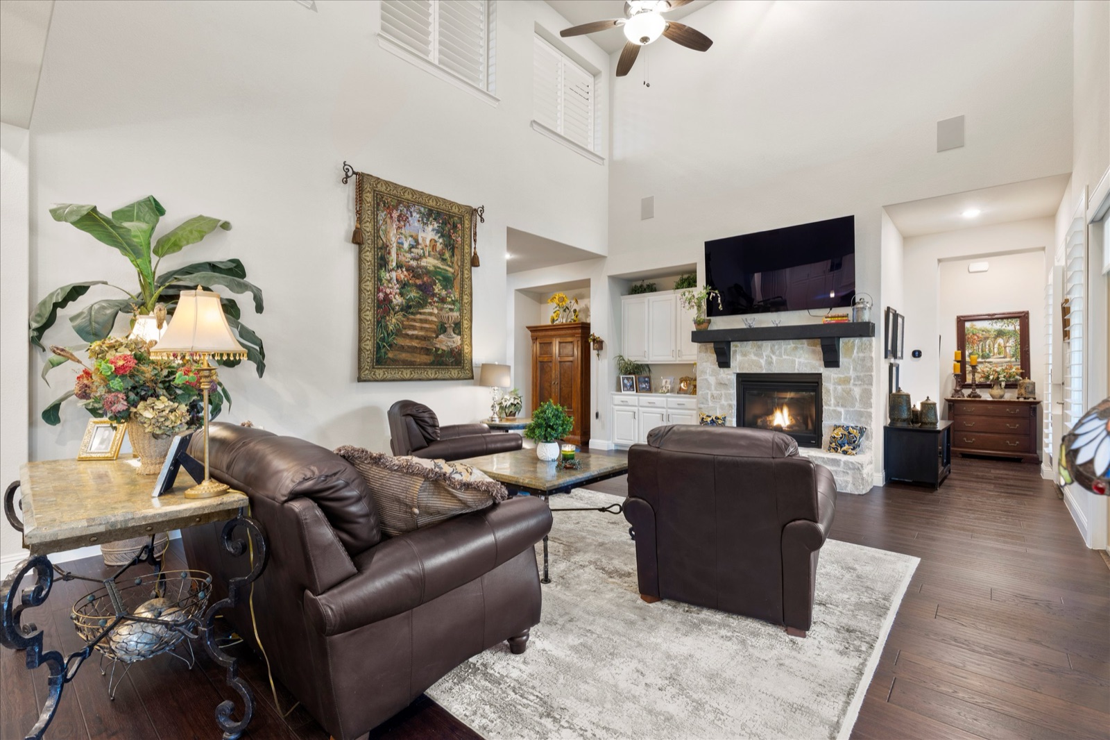 Family room with stone fireplace and built-ins