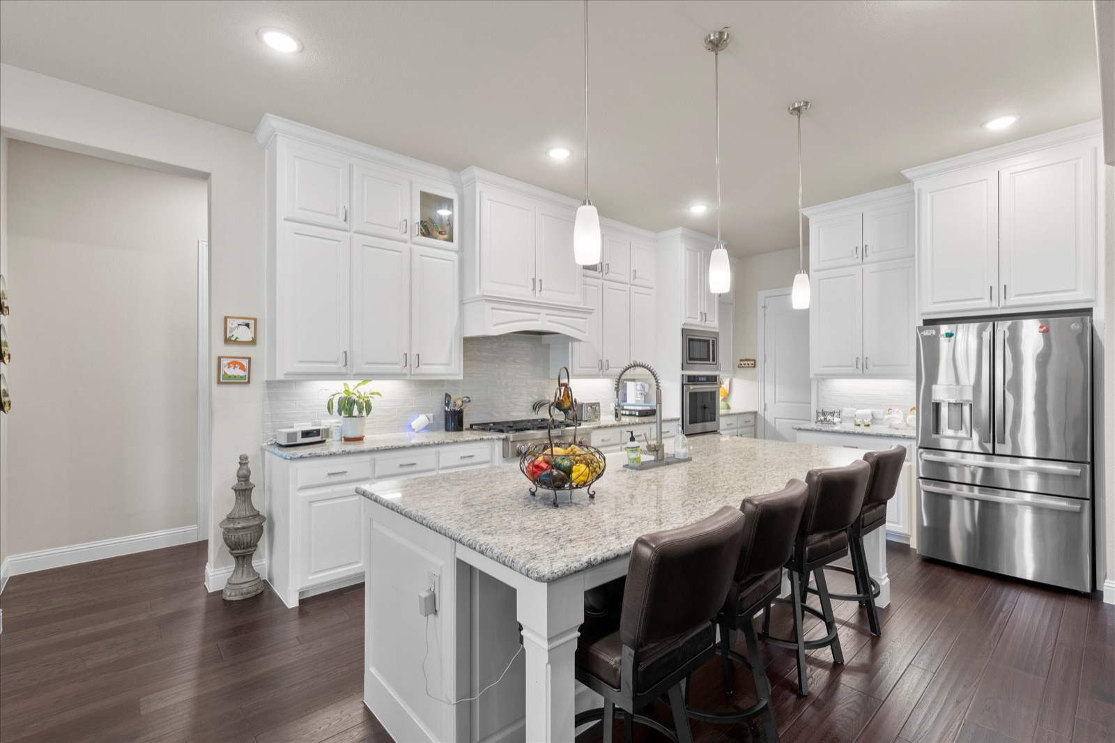Kitchen island and refrigerator wall