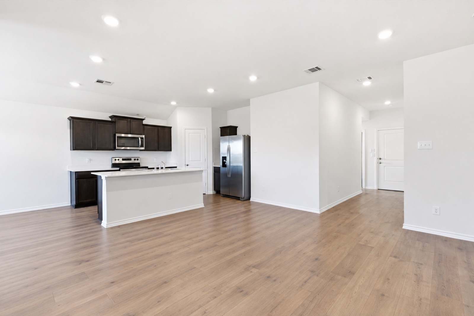 Living room and kitchen, unfurnished