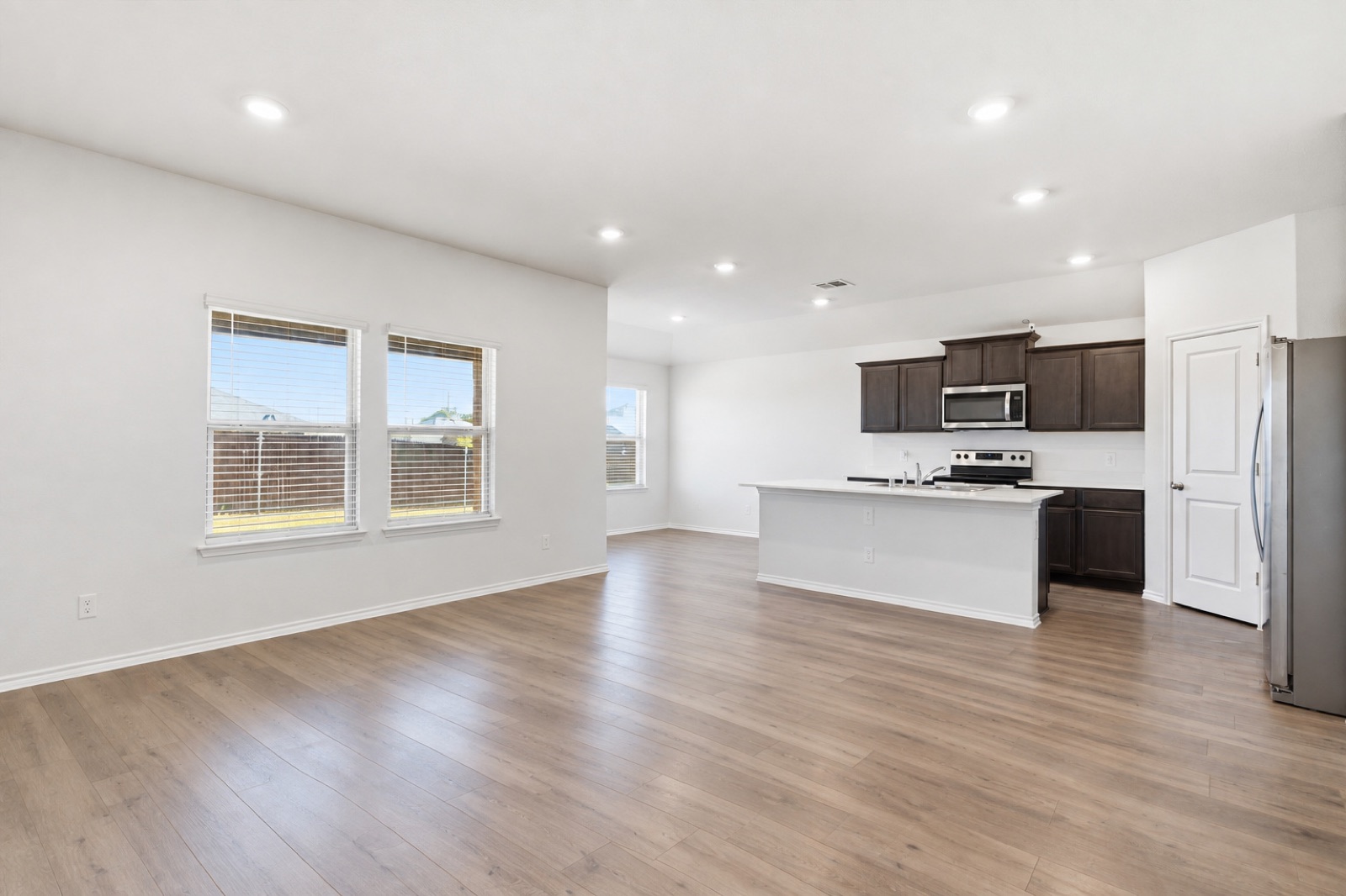 Living room and kitchen, second angle, unfurnished